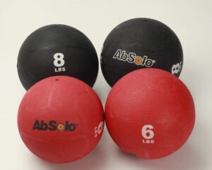 Two red and two black slam balls